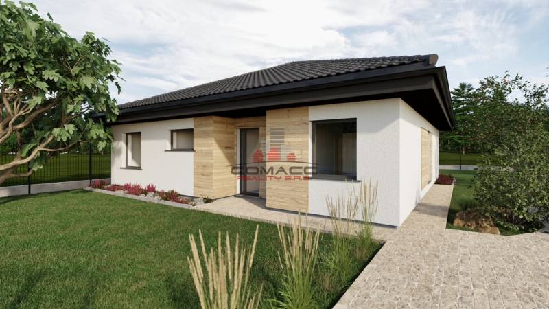 Family house on Kostolná Street in Drahovce with a lawn and a landscaped garden.
