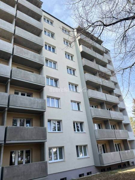 Apartment building on T. Vansovej Street in Prievidza with balconies and a gray facade.