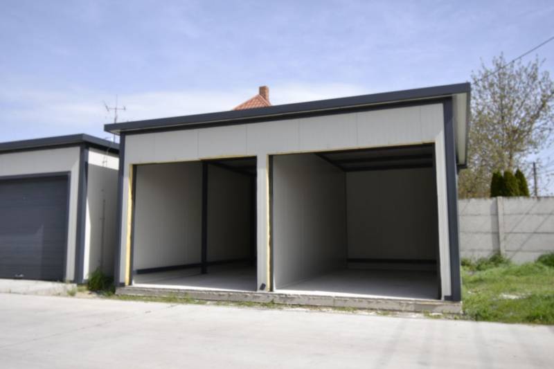 Garages in Michal na Ostrove with gray walls and empty interiors.