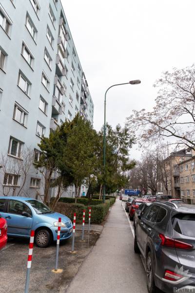 Apartment building on Ondavská Street in Bratislava - Nivy, surrounded by cars and trees.
