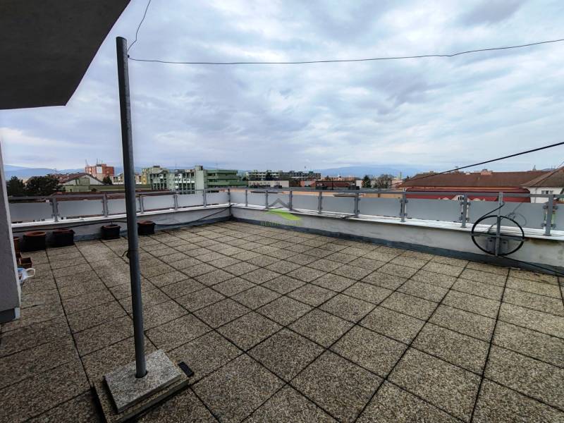 Terrace of a 4-room apartment with a view of the rooftops in Sídlisko I in Vranov nad Topľou.