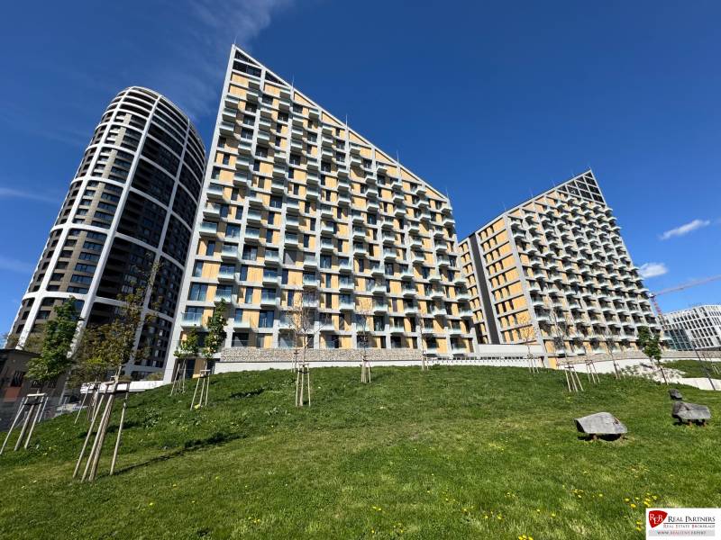 Greenery in front of modern apartment buildings on Bottova Street in Bratislava - Old Town.