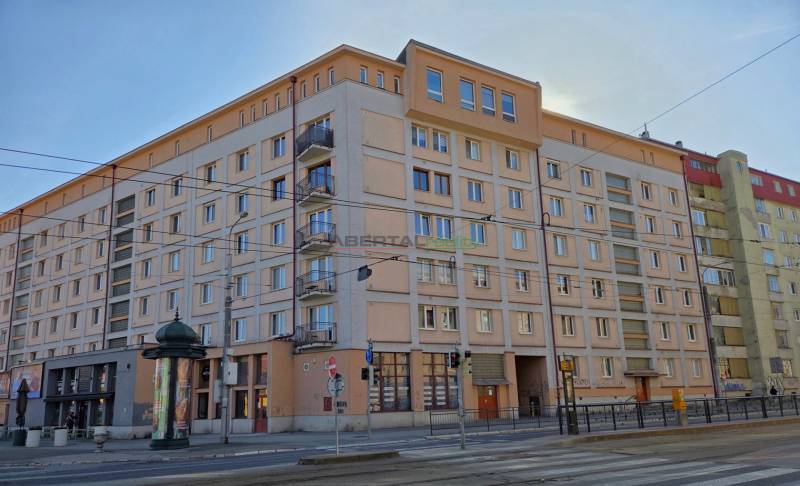 ČSA Street in Košice - Old Town district with an apartment building and a tram track.