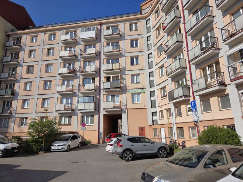 A five-story apartment building on ČSA Street, Košice - Staré Mesto district with a parking lot.