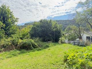 A garden by a family house in Krivosúdy-Bodovka surrounded by greenery and trees.