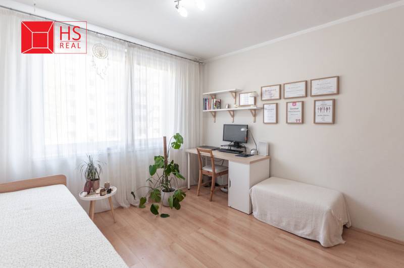 A work corner with wooden floor decor and furniture in a 3-room apartment.