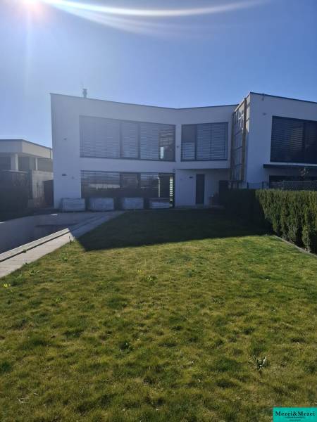 A family house in Zvončín with a spacious lawn and sunny exterior.