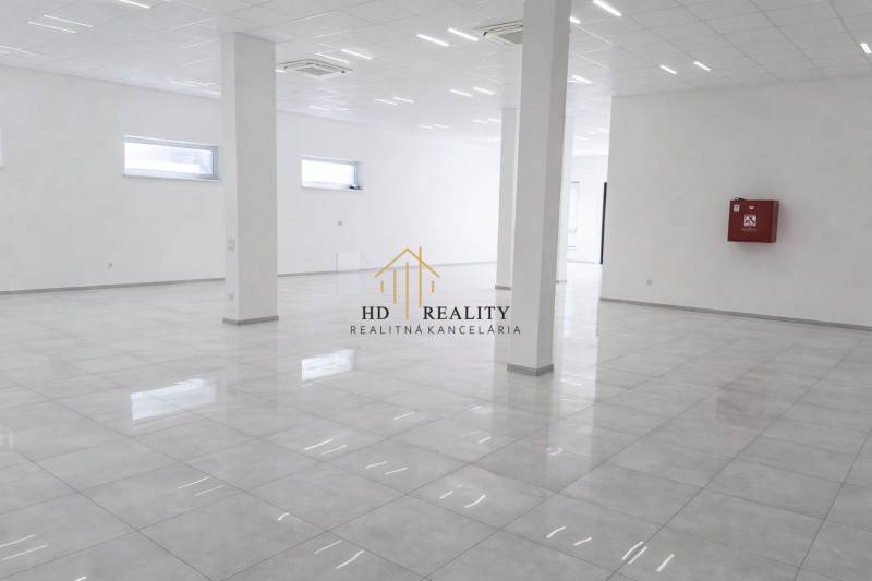 Spacious commercial spaces with white walls and glossy flooring in a decorative design.
