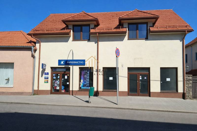 Commercial premises on Obchodná Street in Krupina with a sloped roof and display windows.