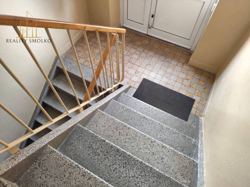 The staircase in the apartment building on Mierová Street in Sabinov with tiles.
