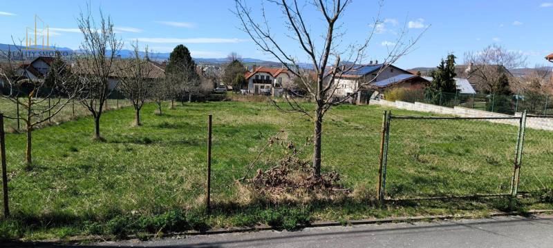 Plots - housing in Ľubotice with fruit trees and a view of the surrounding landscape.