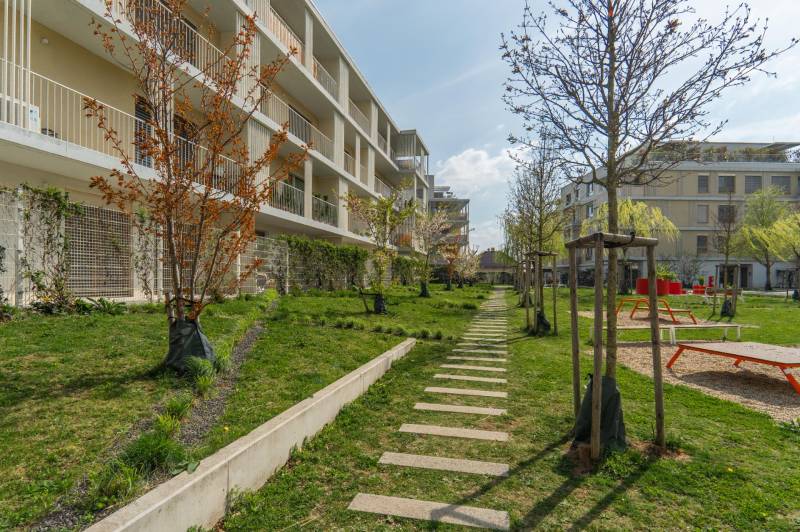An apartment building surrounded by landscaped greenery and walkways in Bratislava - Ružinov.