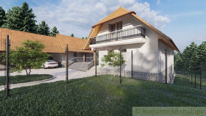 A family house in Šiatorská Bukovinka with a gabled roof, balcony, garage, and fencing.