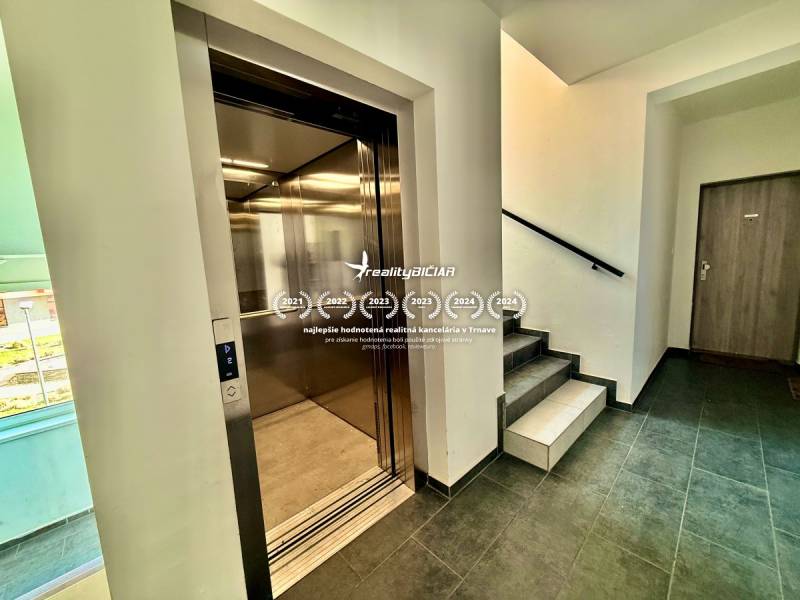 Walls with exchangers, elevator, and staircase in an apartment building on Mikovíniho Street in Trnava.