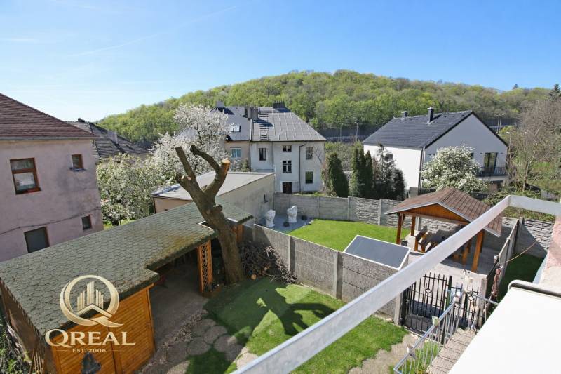 Courtyard with a gazebo and wooden shelter on Boskovičova Street in Bratislava - Nové Mesto.