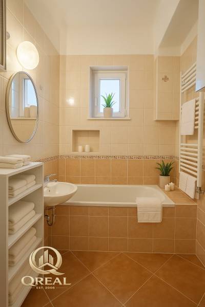 Bathroom in a studio apartment with a bathtub, ceramic tiles, and an open shelf for towels.