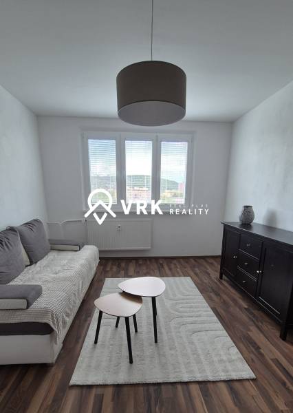 Living room with a sofa and tables on Študentská Street in a 2-room apartment.