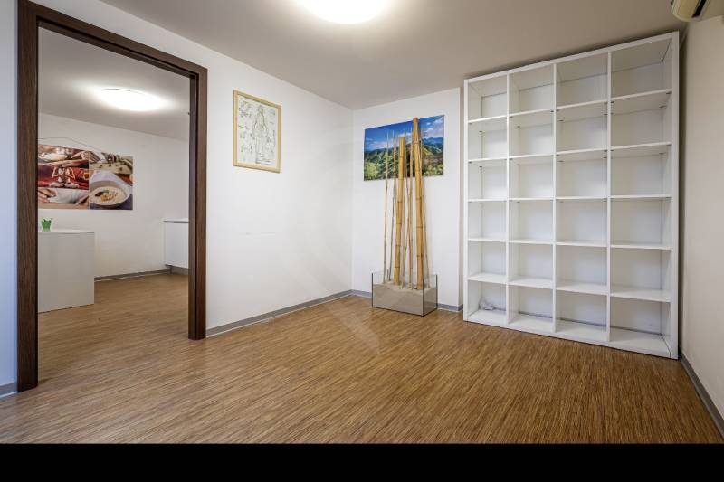 Interior of a family house with a shelving system and a wooden decor floor.