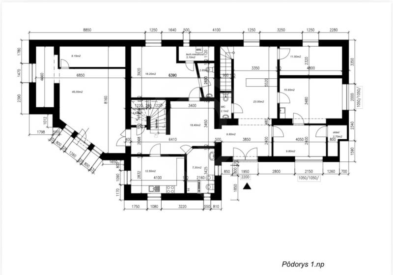 Ground floor plan of a family house with a staircase, rooms, and utility rooms.