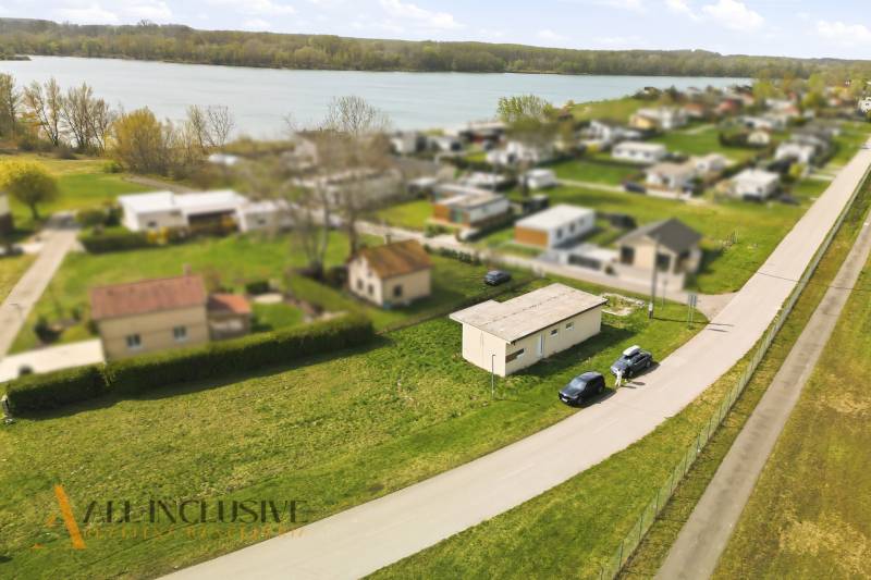 Aerial view of the cottage area near Vojka nad Dunajom with the river in the background.