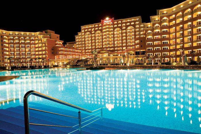 Night panorama of the hotel and pool at Sunny Beach near a one-bedroom apartment.