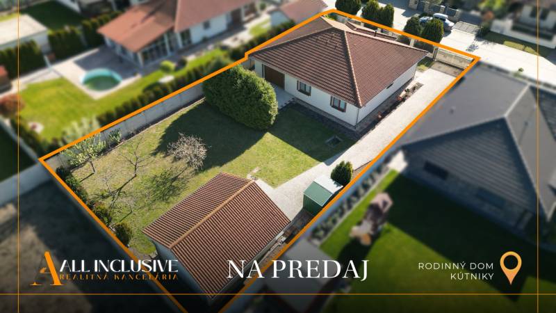 A family house in Kútniky with a well-maintained garden and an access road from a bird's eye view.