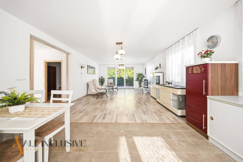 Interior of a family house with a bright living room and a wooden decor floor.
