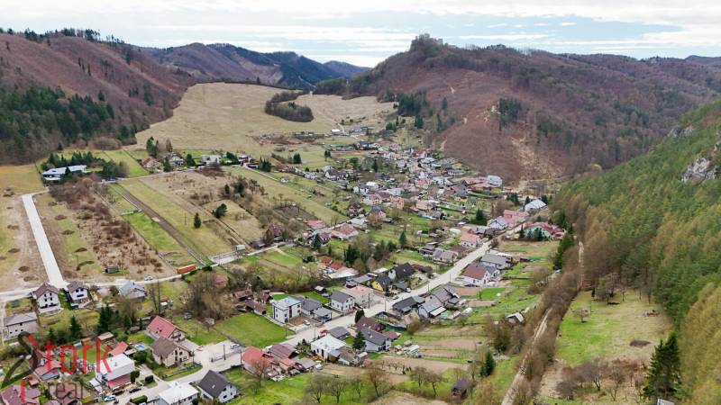 Aerial view of a village surrounded by mountainous landscape in Lietava, on Majer Street, Residential plots.
