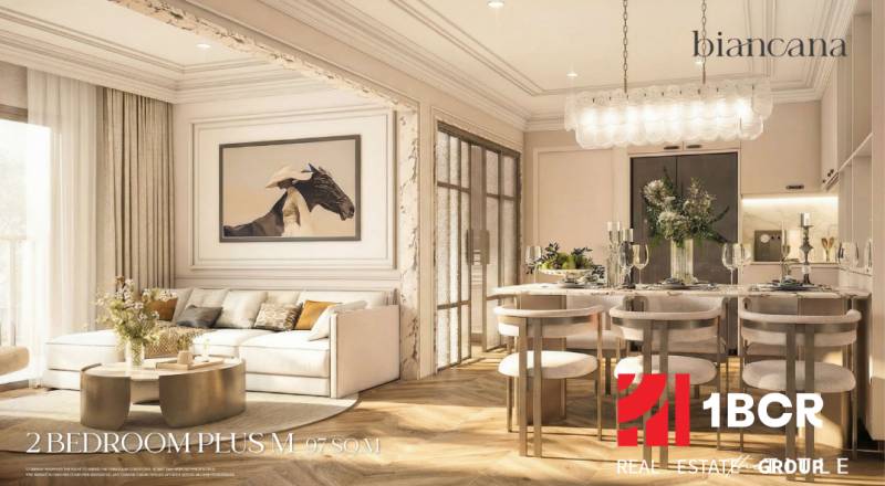 Living room of a three-room apartment with a wooden decor floor and an elegant dining area.