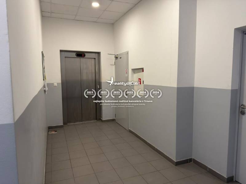 Interior with an elevator, gray tiles, Unique properties.