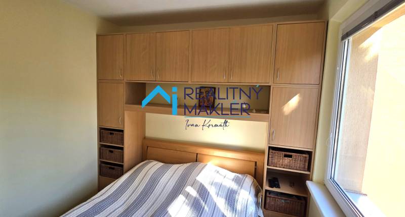 Bedroom with soft walls and storage space in a 3-room apartment.