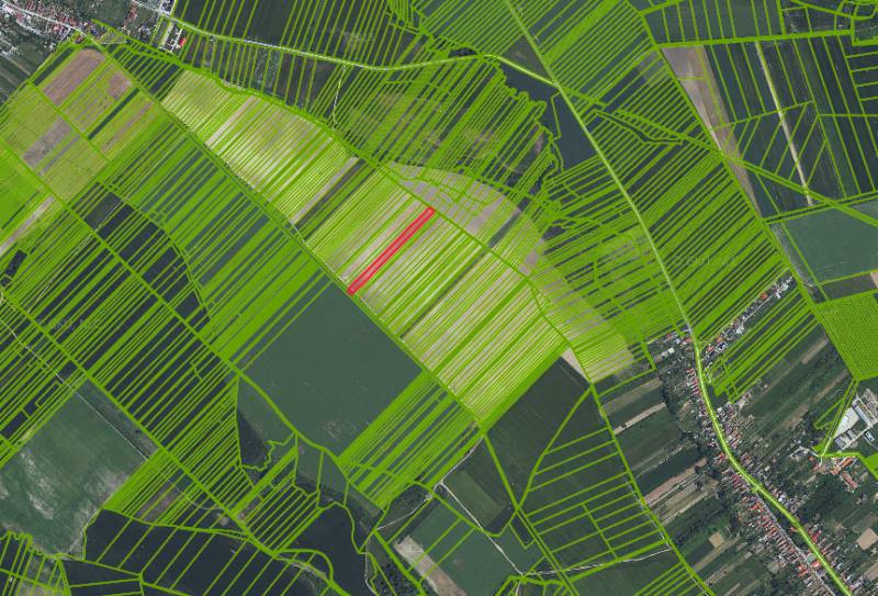 Aerial view of agricultural and forest lands in Častá with map points.