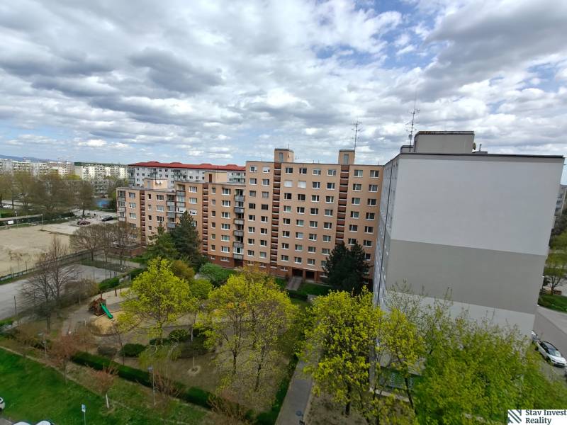A view of apartment buildings and greenery on Jašíkova Street in Bratislava, Ružinov.
