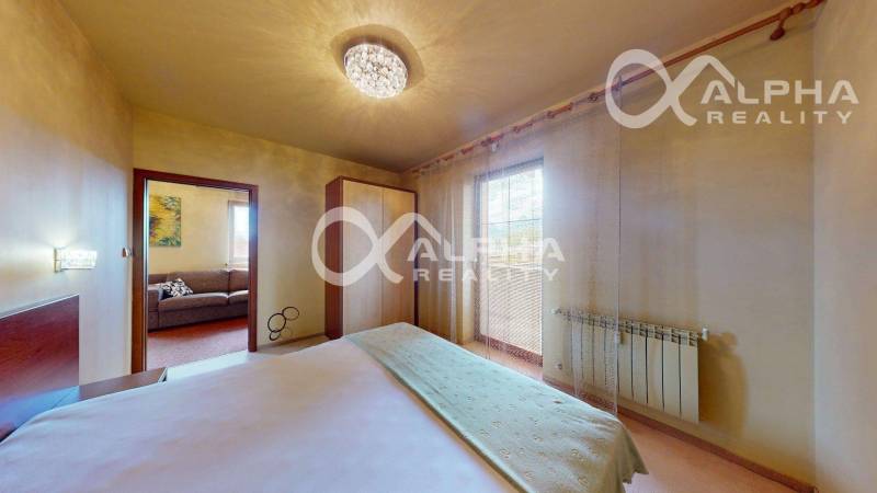 Bedroom with a built-in wardrobe and a window, 2-room apartment, cozy interior.