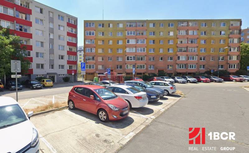 A parking lot in front of apartment buildings in Bratislava - Rača with colorful facades.