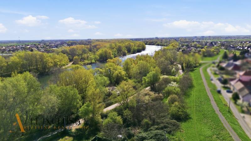 A view of the Gardens in Kráľová nad Váhom with the river and lush greenery.