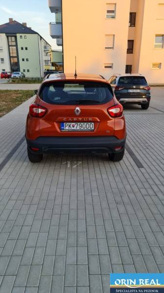 Orange Renault Captur car parked on a paved area in Bratislava - Jarovce, Nyárfa.
