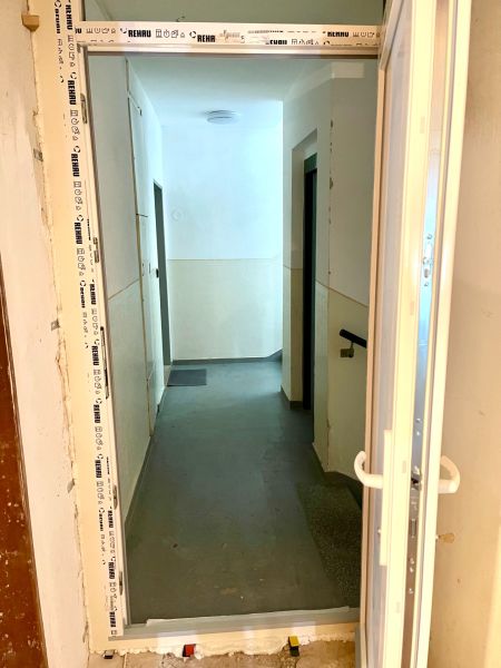 The corridor from the perspective of door reconstruction in the building Warehouses and Halls.