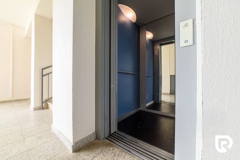 On Armádna Street in Trenčín, there is an elevator and a staircase of an apartment building.