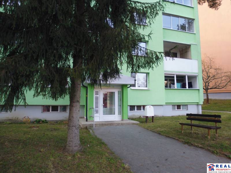 Entrance to an apartment building in Prešov, suitable for a 2-room apartment, green facade.