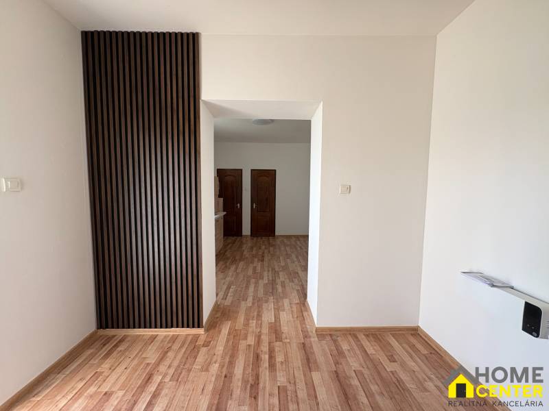 Interior of a family house with a wooden decor floor and wooden wall cladding.