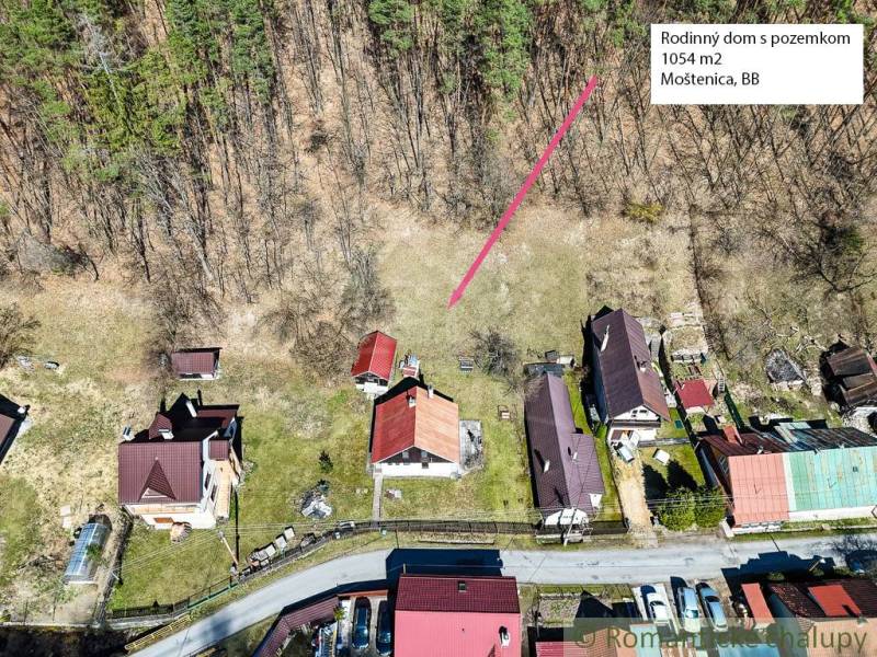Aerial view of a cottage with land in Moštenica near the forest.