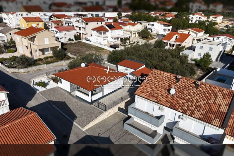 Aerial view of family houses on Mulo Street in Vrsi with red roofs.