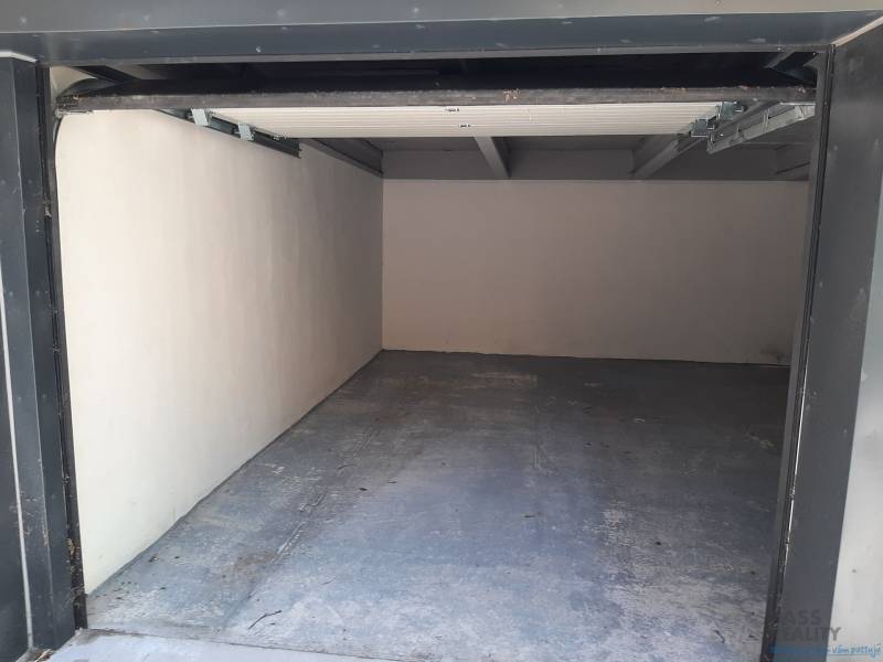 An empty garage on Gajova Street in Bratislava - Old Town with a concrete floor.