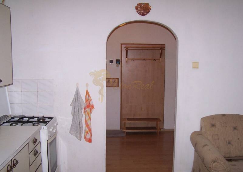 In the kitchen of the 2-room apartment, there is a gas stove and an open passage with hangers.