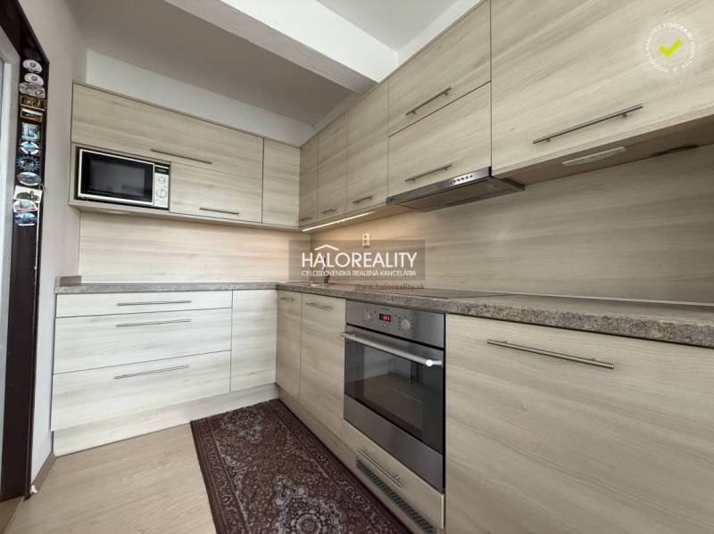 A kitchen in a family house with a wooden decor countertop and floor.