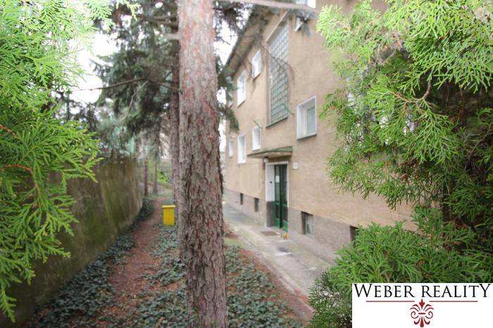 The exterior of the apartment building on Lichardova Street in Bratislava - Old Town surrounded by greenery.