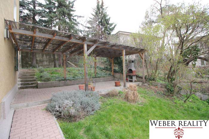 Garden with a covered terrace and fireplace on Lichardova Street in Bratislava - Old Town.