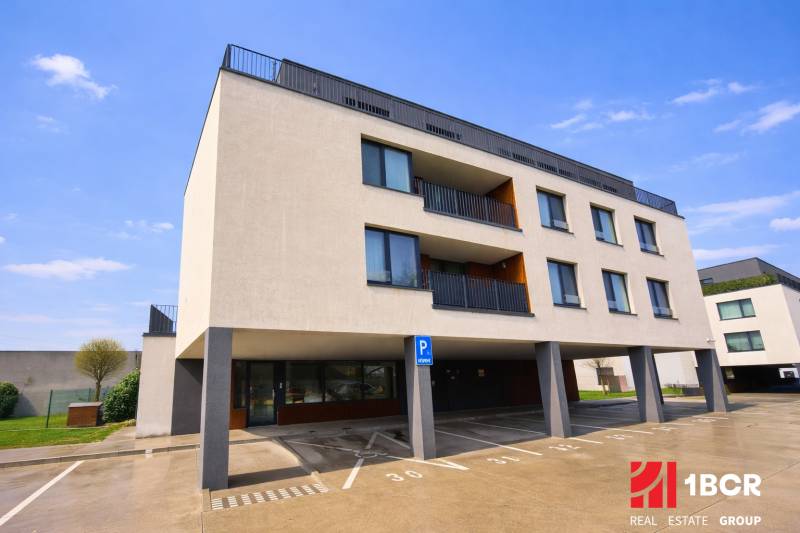 Exterior of the building with a parking lot on Na piesku street, Bratislava - Ružinov.