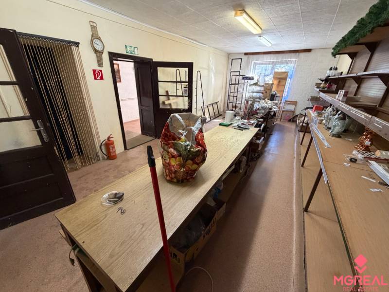 The interior of a family house with older furniture and shelves for storing items.